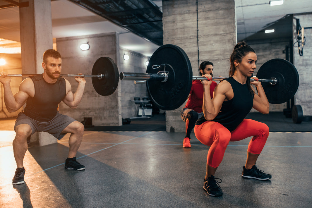 man and woman doing fundamental resistance training workouts