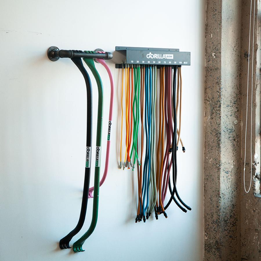 Gorilla Bow Vertical Hanging Rack mounted on wall