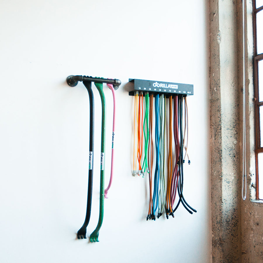 Gorilla Bow Band Rack mounted on wall
